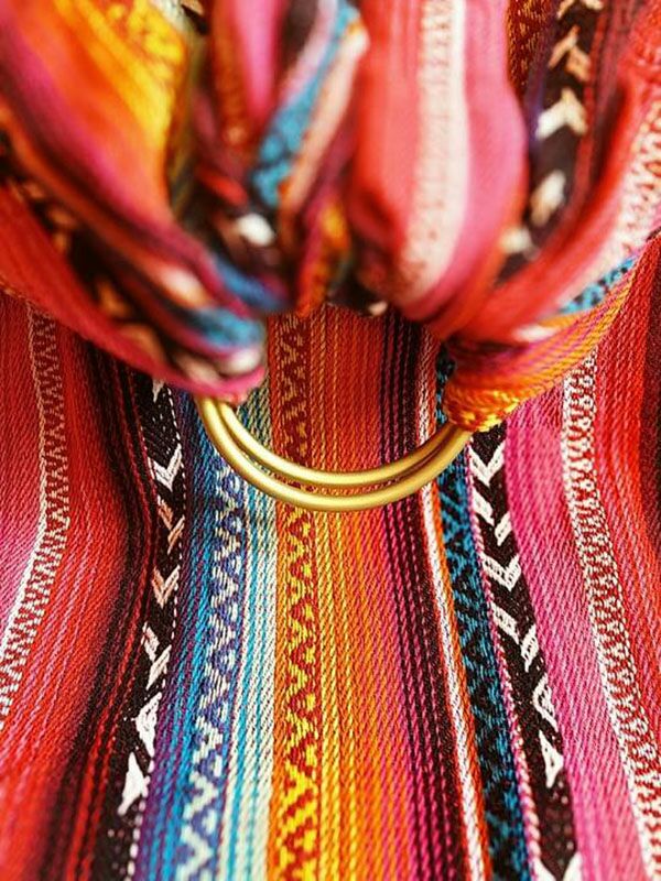Close-up of the Larona Ring Sling showing vibrant rainbow woven patterns and sturdy gold safety-tested ring – Almitra Tattva Bohemian Collection.