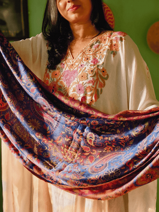 Close-up of Falak Garden Of Rumi Collection wrap fabric with rich blue, copper, and floral detailing, highlighting breathable weave, soft texture, and premium craftsmanship for newborn and infant carriers.