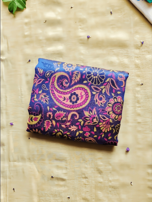 Folded falak baby wrap lying flat, showing compact size, soft breathable fabric, and detailed heritage-inspired print, designed for newborn babywearing and easy everyday carry.