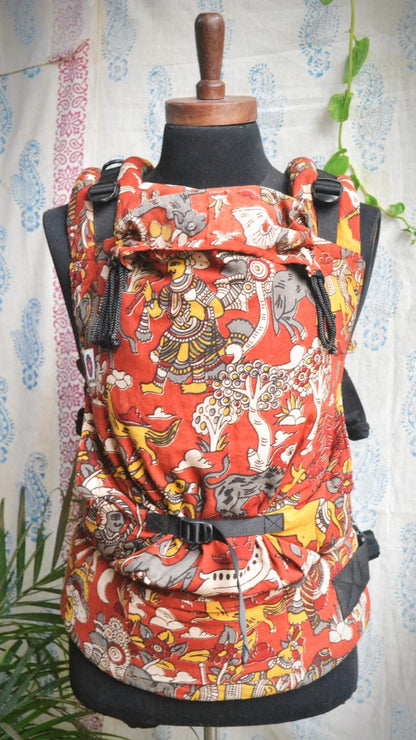 Almitra Tattva Jataka Tales Baby Carrier - Kalamkari ergonomic with padded shoulder straps and waist belt, soft structured newborn carrier designed for hands-free parenting and breathable everyday babywearing.