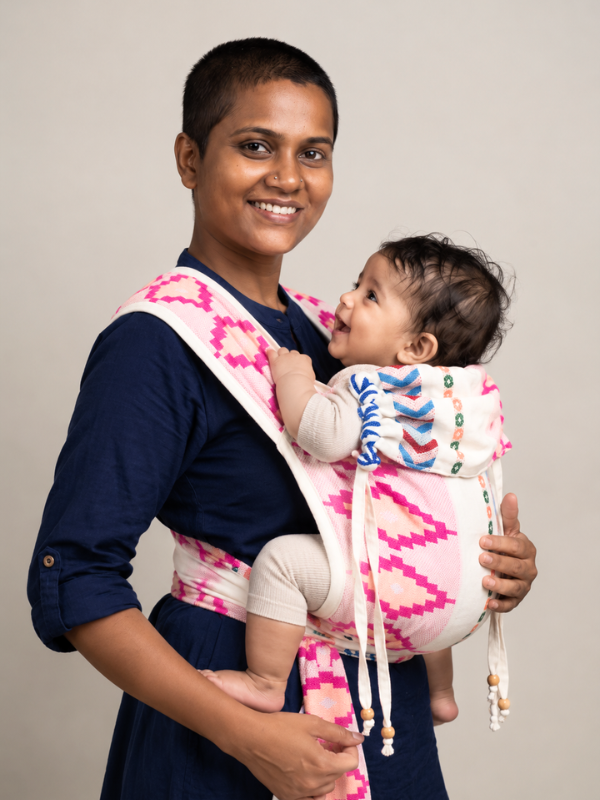 Shubra Meh Dai baby carrier shown in a three-quarter view with baby